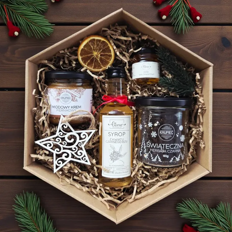 Wnętrze świątecznego zestawu z syropem, miodem i herbatą