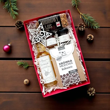 Wnętrze świątecznego czerwonego pudełka z pigwą, miodem i miodowymi dodatkami