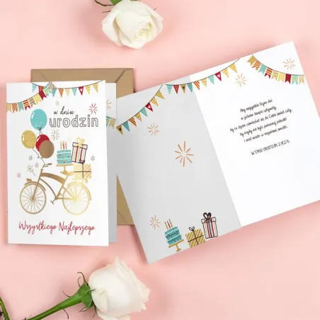 Karnet urodzinowy z rowerem, balonami, prezentami i ciemnozłotą kopertą.