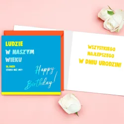 Neonowy karnet Quadro z zabawnym napisem i pomarańczową kopertą.